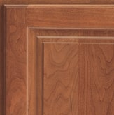 Corner of a KraftMaid cabinet door showing Cherry wood in Ginger finish