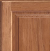 Corner of a KraftMaid cabinet door showing Hickory wood in Ginger finish