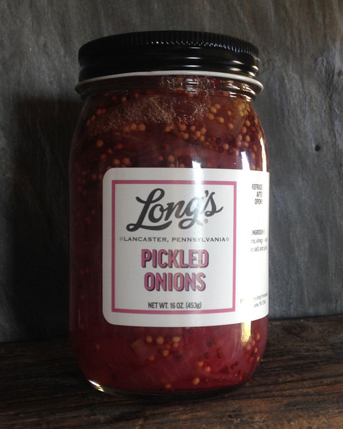 Red onions become a thing of beauty when pickled with mustard seeds and a bay leaf. A mild sweet onion flavor, great on sandwiches and salads or highlighting your charcuterie board. 16 ounces