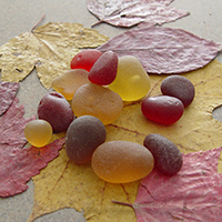 Red and gold sea glass pieces