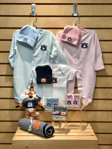 Quality made collegiate baby items: newborn cap, newborn/0-3 months footie, newborn t-shirt, newborn booties, baby blanket and an Aubie plush