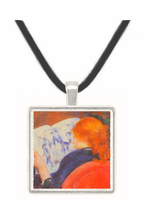 Young woman reads illustrated journal by Renoir -  Museum Exhibit Pendant - Museum Company Photo