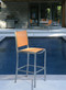 Armless High Dining Chair Pictured in Orange Sling