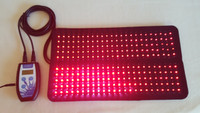 Red and Infrared LED light therapy pad for pain relief, showing flexible design and controller