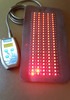 Red and Infrared LED light therapy pad for pain relief, showing flexible design and controller