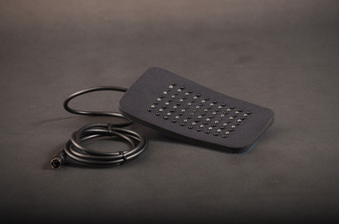 Red LED light therapy pad for pain relief and inflammation, showing flexible design