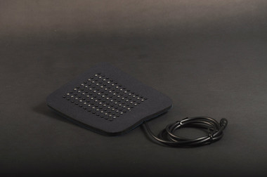 Red LED light therapy pad for pain relief and inflammation, showing flexible design