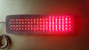 Red LED light therapy pad for pain relief and inflammation, showing flexible design specifically for treating large areas.