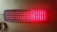 Red LED light therapy pad for pain relief and inflammation, showing flexible design specifically for treating large areas.
