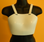 Women's Chest Protector, A single piece of hard plastic that contours to the area between the clavicle and sternum.  Mandatory for females in competition. 
Front view