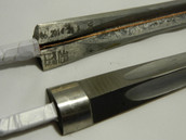 Epee Electric Wired Blade, STM/FIE (Maraging) is a high quality blade for the serious competitive fencer. Available in Silver, Blue, Multi-Colored

Note: Tangs can be cut to match the type of grip you are using.
  The Short Tang is commonly used for smaller grips, such as the Visconti.
  The Medium Tang is used for slightly larger grips, such as the Belgian.
  The Long Tang is used for the longer grips, such as the French.
Blades usually come with the Long Tang, if you use a French-type grip, or would like to cut your own to match your own grips.