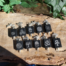 Shungite Pendulums with engraved symbols.
