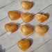 picture of 8 different Orange Calcite Hearts