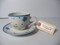 Manila tag on a tea cup with large Adhesive Inventory Label