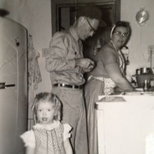 1950s kitchen with Grandma washing dishes in apron