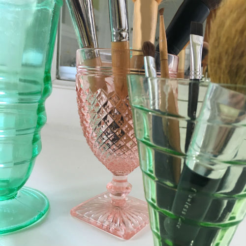 Colorful Depression Glass used for Makeup Brushes