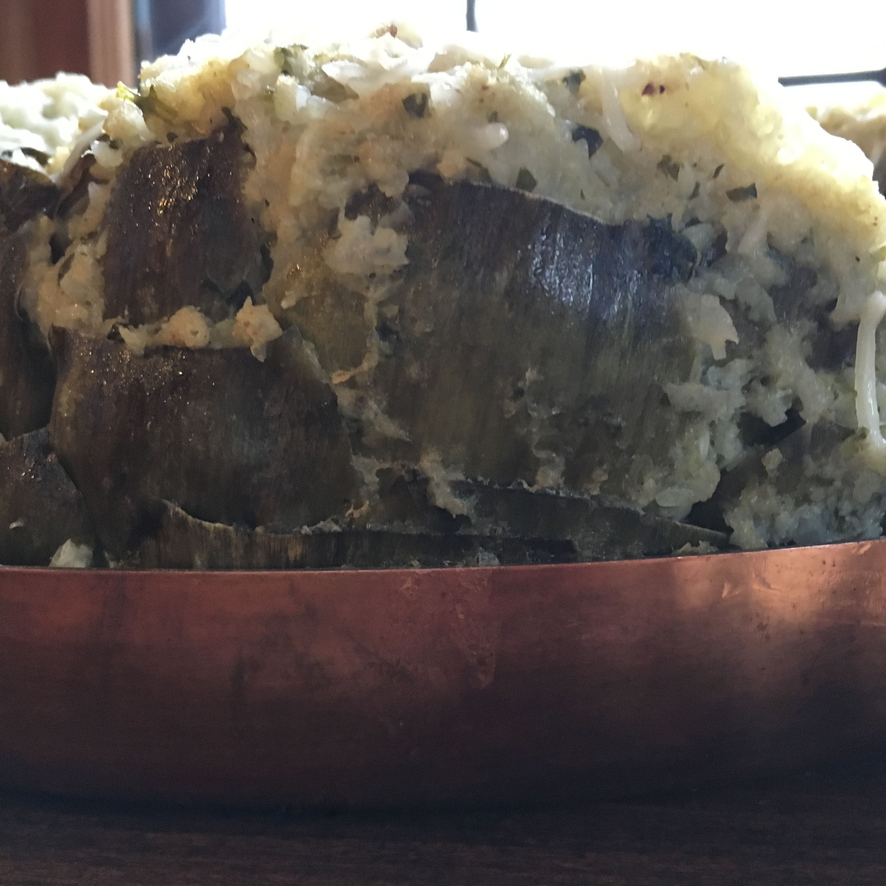Artichokes stuffed with cauliflower in vintage copper pan