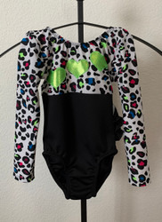 ONLY 1 AVAILABLE IN THIS SIZE AND STYLE! Closeout long sleeve gymnastics and/or dance leotard in the print shown.  Free scrunchie as always!

Due to the discount prices there are no returns or exchanges on these items.