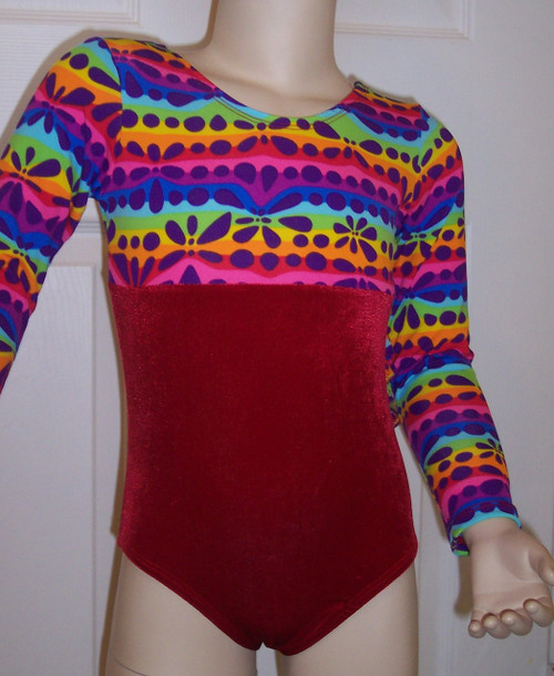 Cute long sleeve gymnastics and/or dance leotard in a DARE TO TRY spandex print split with coordinating red velvet. Free scrunchie as always