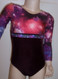 Cute long sleeve gymnastics and/or dance leotard in a COSMIC spandex print split with burgundy velvet and split with a row of coordinating trim. Free scrunchie as always