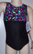 Cute gymnastics and/or dance leotard in a SHATTERED GLASS spandex split with black spandex. Coordinating black spandex shorts with SHATTERED GLASS waistband included. Available in tank or racer back. Free scrunchie as always!