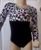 Cute long sleeve gymnastics and/or dance leotard in a SPRING CHEETAH spandex print split with a solid black spandex. Free scrunchie as always