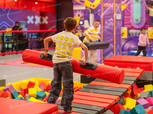 Commercial trampoline park foam pit and jumping court area