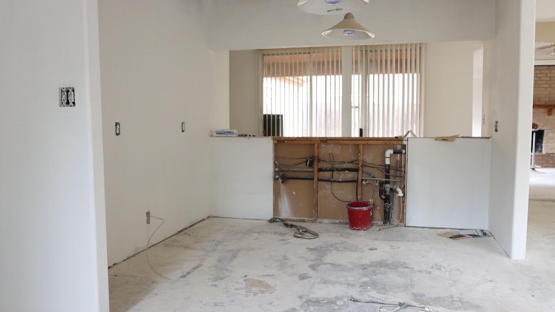 Unfinished 70s-built kitchen undergoes renovation to now include an open concept floor plan.