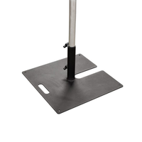 Doughty Tank Trap Fixed Base (T54250) broad steel base, carry handle, stacking slot, and vertical scaffold bar supported at two clamp points.