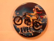 Evel Knievel button on Harley jump bike in the clouds