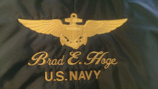 Gold Wings on green helmet bag