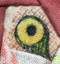 Flamingo Picture Piecing Quilt A close up of the Flamingo's eye.