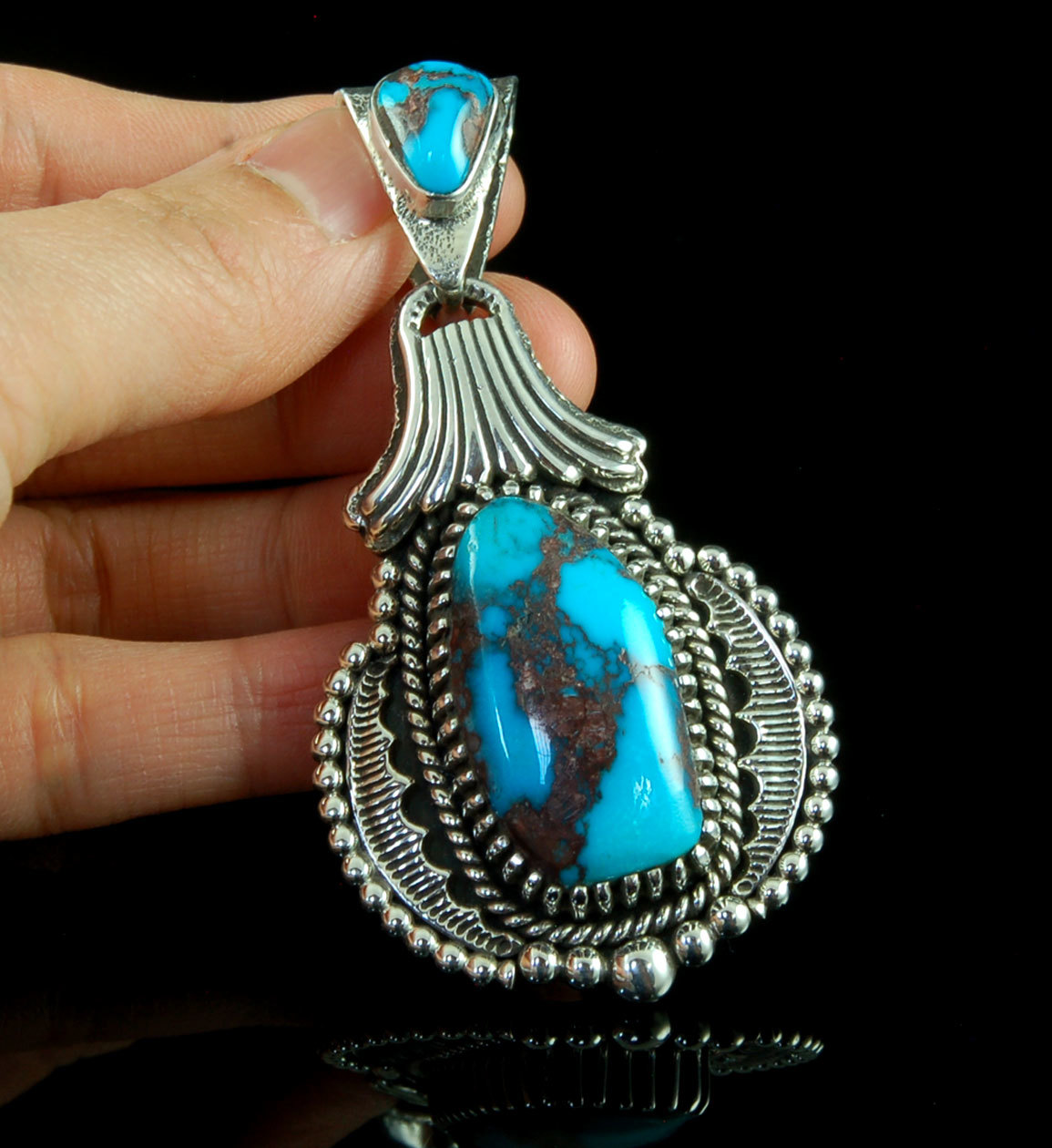 Handmade Sterling Silver pendant by John Hartman with high grade natural Bisbee Turquoise from Arizona.