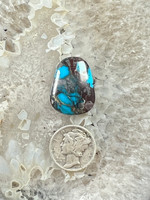 Smokey Bisbee Turquoise with Brown Quartz Matrix, very unique, hand cut by John Hartman from a natural Turquoise Nugget. It weighs 17.5 carats.