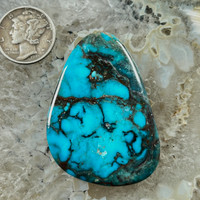 A fantastic black spiderweb, smoky Bisbee Turquoise cabochon