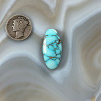 A spectacular oval number eight Spiderweb Turquoise cabochon