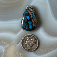 Royal smoky blue Bisbee with quartz cabochon.