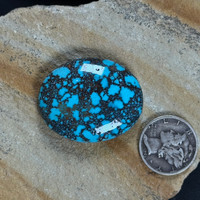 Dynamic spiderweb Bisbee Turquoise oval cabochon