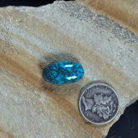 Beautiful spiderweb Bisbee Turquoise oval cabochon