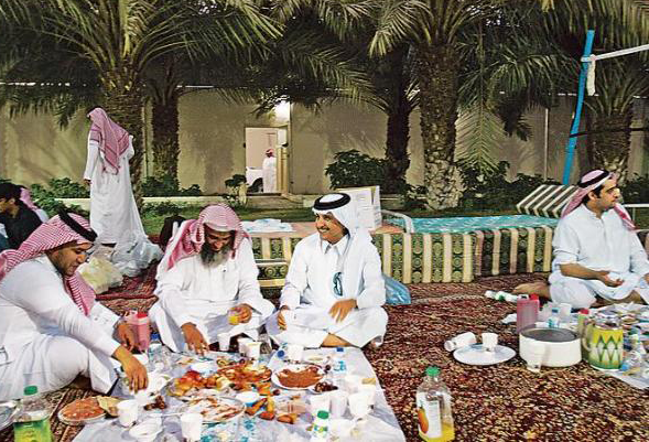 Desert Arabs enjoying a meal