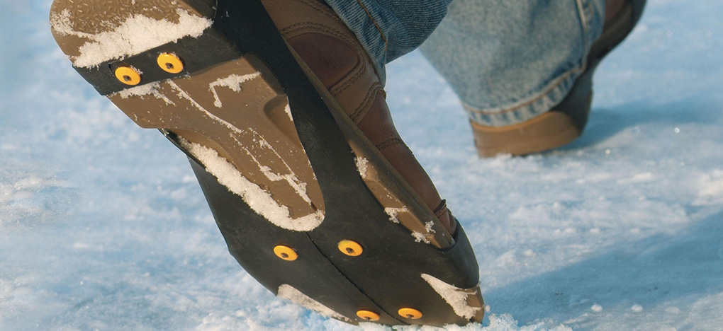 Walking in Industrial strength ice cleats 