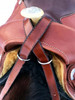 Collar straps wrap around pommel and criss-cross on either side of saddle horn.
