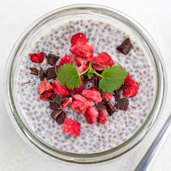 vanilla chia pudding topped with freeze dried strawberries and dark chocolate