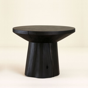 Monolith Center Table
36 diameter x 30 H inches
Ebony