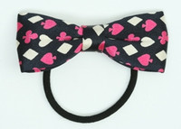 Poker pink bow hair tie