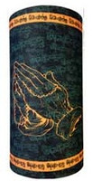 Praying hands and chains on green