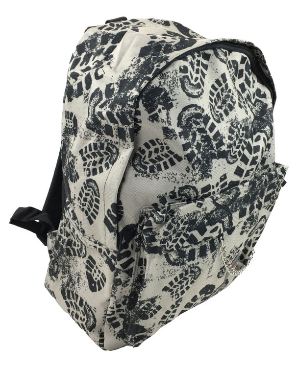 Black shoe step on grey mix rucksack