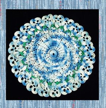 Verigated blue and green circular doily