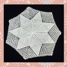 White cotton heptagonal doily