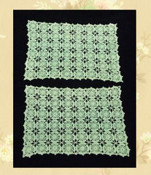 Pair of pale green doilies